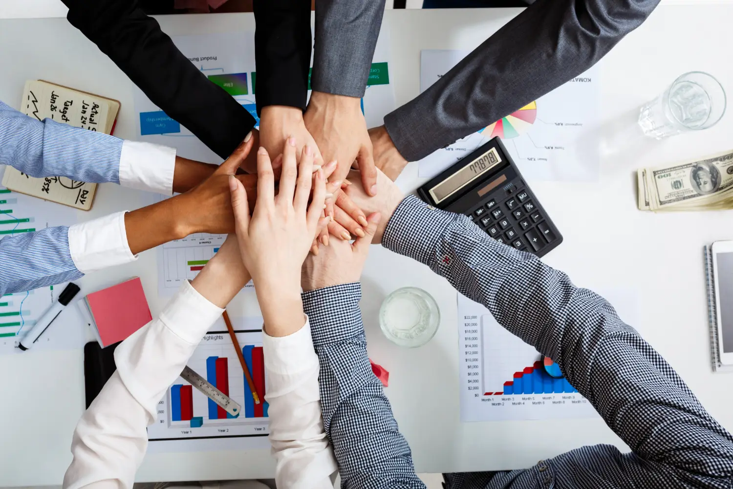 businessmen-hands-white-table-with-documents-drafts businessmen-hands-white-table-with-documents-drafts