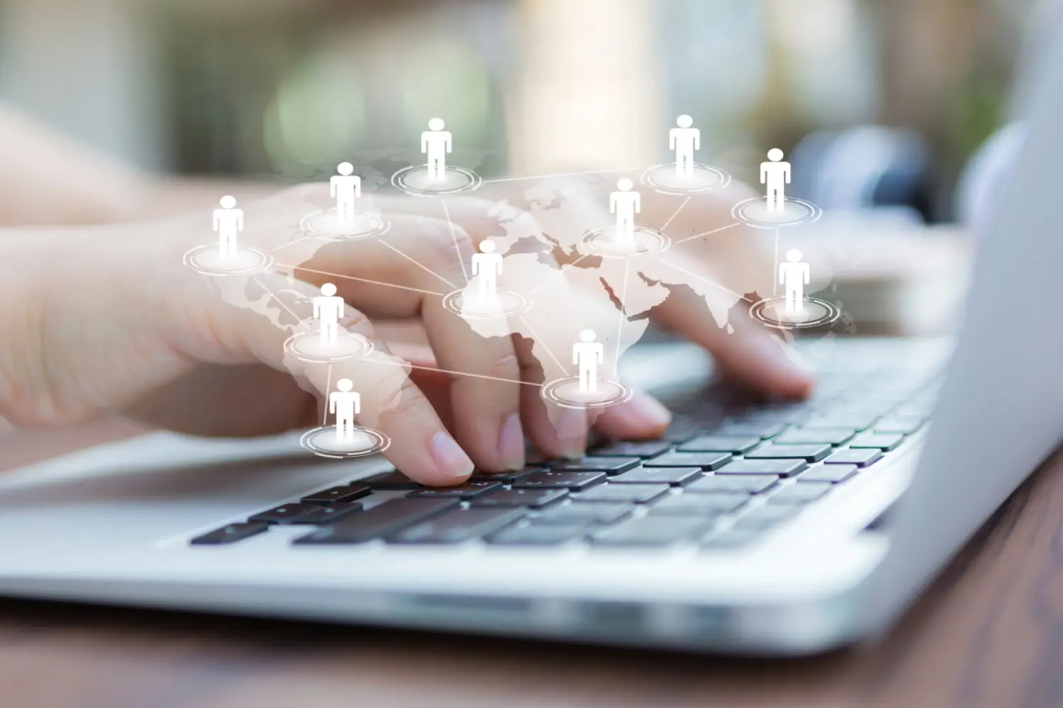 hands-with-laptop-virtual-world-map hands-with-laptop-virtual-world-map